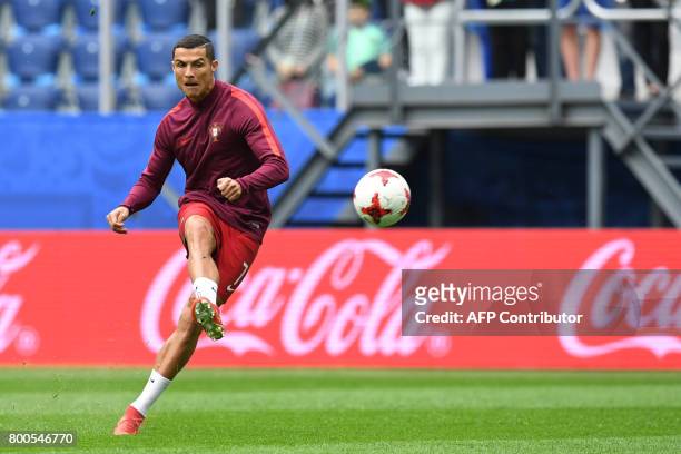 Portugal's forward Cristiano Ronaldo warms up ahead of the 2017 Confederations Cup group A football match between New Zealand and Portugal at the...
