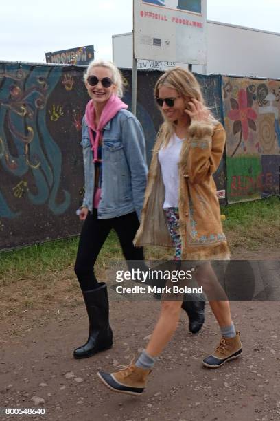 Poppy Delevingne and Sienna Miller attend day 2 of the Glastonbury Festvial on June 24, 2017 in Glastonbury, England.