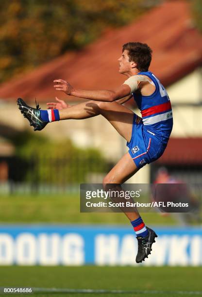 Nathan Mullenger-McHugh of the Bulldogs kicks the ball during the 2017 VFL round 10 match between the Footscray Bulldogs and the Werribee Tigers at...