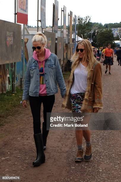Poppy Delevingne and Sienna Miller attend day 2 of the Glastonbury Festival on June 24, 2017 in Glastonbury, England.