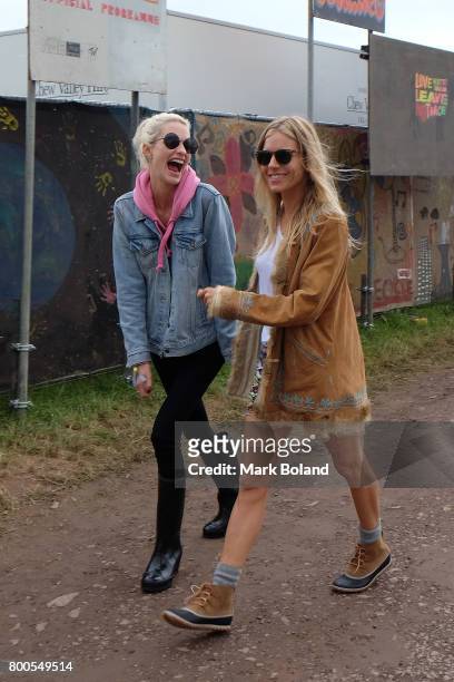 Poppy Delevingne and Sienna Miller attend day 2 of the Glastonbury Festival on June 24, 2017 in Glastonbury, England.