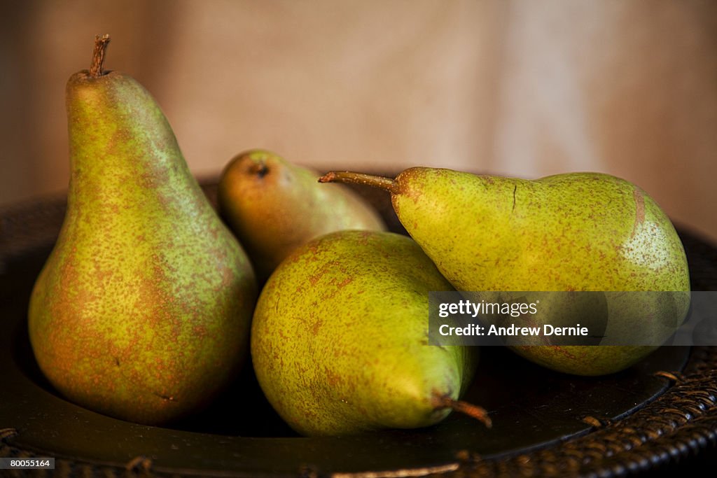 Organic Pears in a wooden bowl.