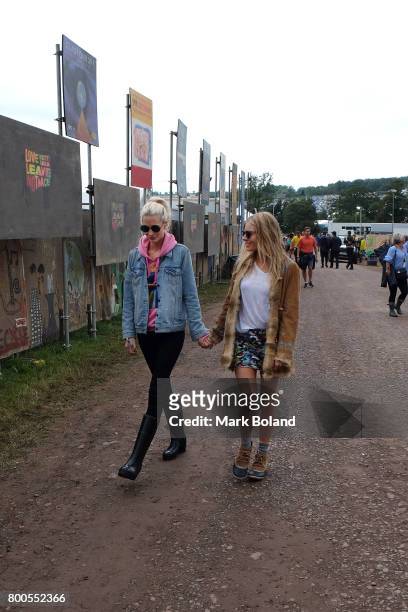 Poppy Delevingne and Sienna Miller attend day 2 of the Glastonbury Festvial on June 24, 2017 in Glastonbury, England.