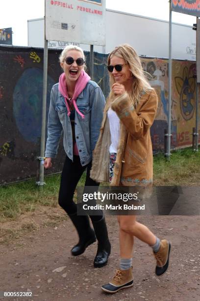 Poppy Delevingne and Sienna Miller attend day 2 of the Glastonbury Festvial on June 24, 2017 in Glastonbury, England.