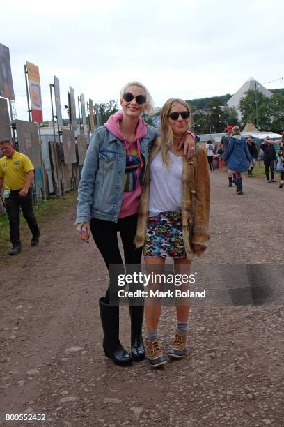 Poppy Delevingne and Sienna Miller attend day 2 of the Glastonbury Festvial on June 24, 2017 in Glastonbury, England.