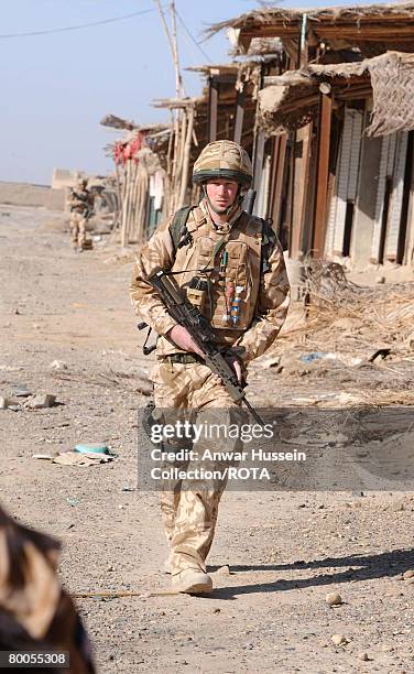 Prince Harry patrols through the deserted town of Garmisir on January 2, 2008 in Helmand Province, Afghanistan.