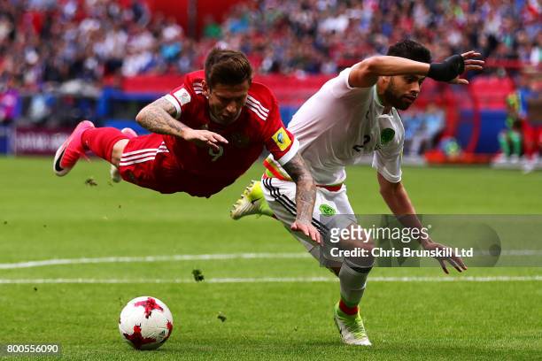 Nestor Araujo of Mexico in action with Fedor Smolov of Russia during the FIFA Confederations Cup Russia 2017 Group A match between Mexico and Russia...
