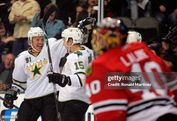 Left wing Niklas Hagman of the Dallas Stars celebrates his goal with Brad Richards in front of Patrick Lalime of the Chicago Blackhawks at the...