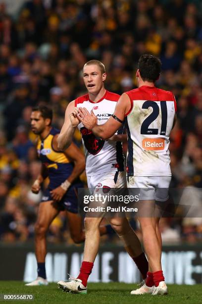 Tom McDonald and Cameron Pedersen of the Demons celebrate a goal during the round 14 AFL match between the West Coast Eagles and the Melbourne Demons...