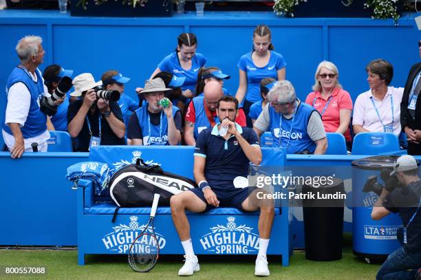 Marin Cilic of Croatia takes a break during the Semi Final match against Gilles Muller of Luxemburg on day six at Queens Club on June 24, 2017 in...