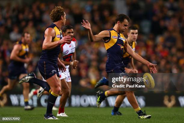 Dom Sheed of the Eagles kicks the ball during the round 14 AFL match between the West Coast Eagles and the Melbourne Demons at Domain Stadium on June...