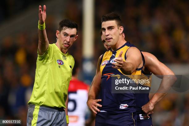 Elliot Yeo of the Eagles discusses a free kick with the umpire during the round 14 AFL match between the West Coast Eagles and the Melbourne Demons...