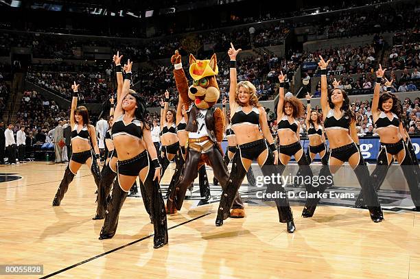 The Coyote and Silver Dancers of the San Antonio Spurs perform during a time-out against the Dallas Mavericks on February 28, 2008 at the AT&T Center...