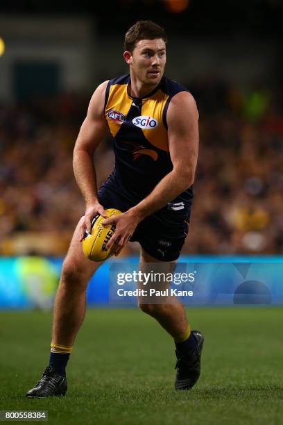 Jeremy McGovern of the Eagles looks to pass the ball during the round 14 AFL match between the West Coast Eagles and the Melbourne Demons at Domain...