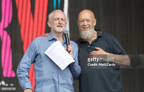 Labour Party leader Jeremy Corbyn and festival founder Michael Eavis address the crowd from the main stage a the Glastonbury Festival site at Worthy...