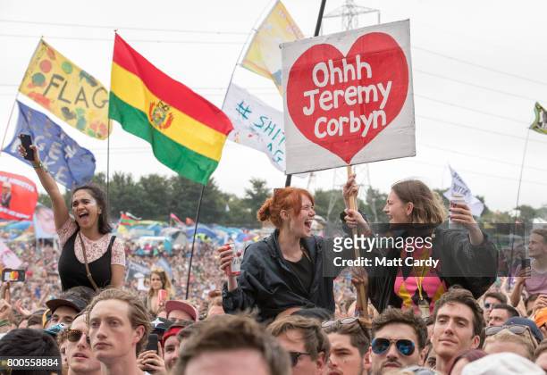 Crowds cheer Labour Party leader Jeremy Corbyn address the crowd from the main stage a the Glastonbury Festival site at Worthy Farm in Pilton on June...