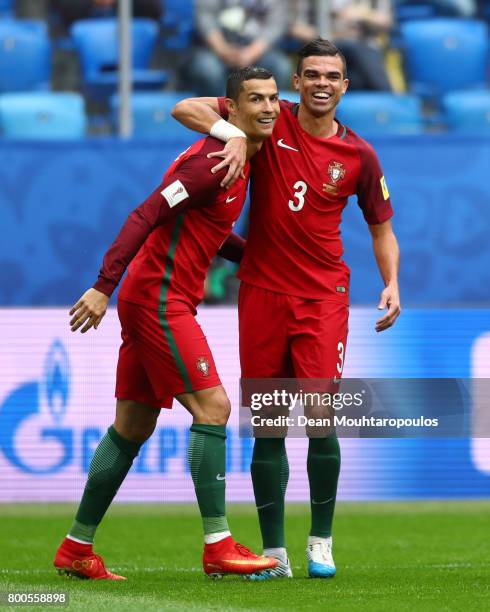 Cristiano Ronaldo of Portugal celebrates scoring his sides first goal with Pepe of Portugal during the FIFA Confederations Cup Russia 2017 Group A...