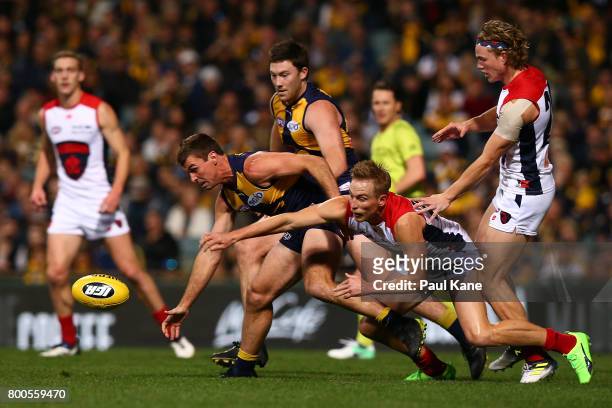 Jamie Cripps of the Eagles and Bernie Vince of the Demons contest for the ball during the round 14 AFL match between the West Coast Eagles and the...