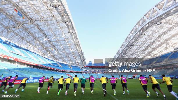 Players run during a Cameroon training session at Fisht Olympic Stadium ahead of their FIFA Confederations Cup Russia 2017 Group B match against...