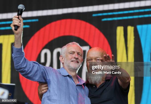 Labour Party leader Jeremy Corbyn and festival founder Michael Eavis address the crowd from the main stage at the Glastonbury Festival site at Worthy...