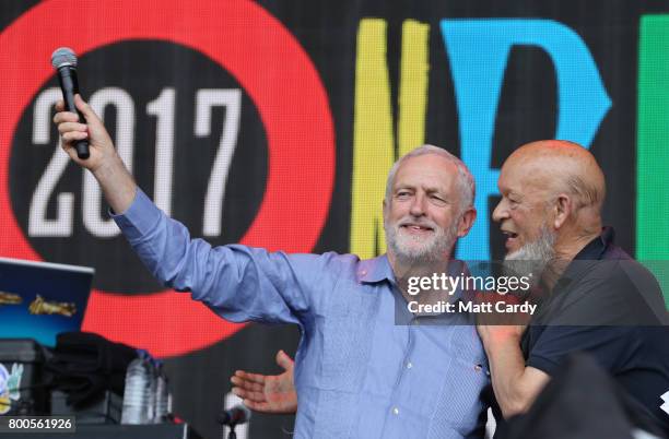 Labour Party leader Jeremy Corbyn and festival founder Michael Eavis address the crowd from the main stage at the Glastonbury Festival site at Worthy...