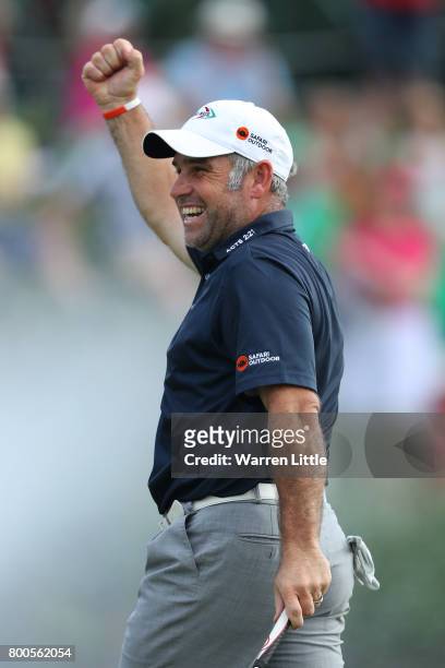 Hennie Otto of South Africa celebrates on the 18th green during day three of the BMW International Open at Golfclub Munchen Eichenried on June 24,...