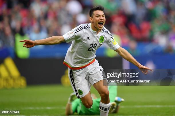 Mexico's forward Hirving Lozano celebrates after scoring the team's second goal during the 2017 Confederations Cup group A football match between...