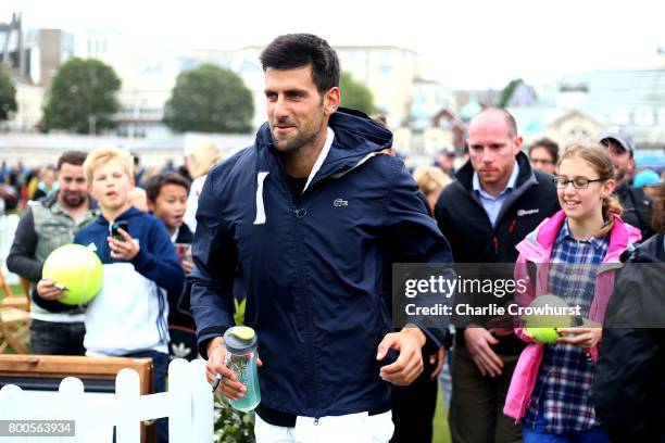 Novak Djokovic of Serbia looks to escape the crowd of fans during Qualifying on Day 2 of The Aegon International Eastbourne on June 22, 2017 in...