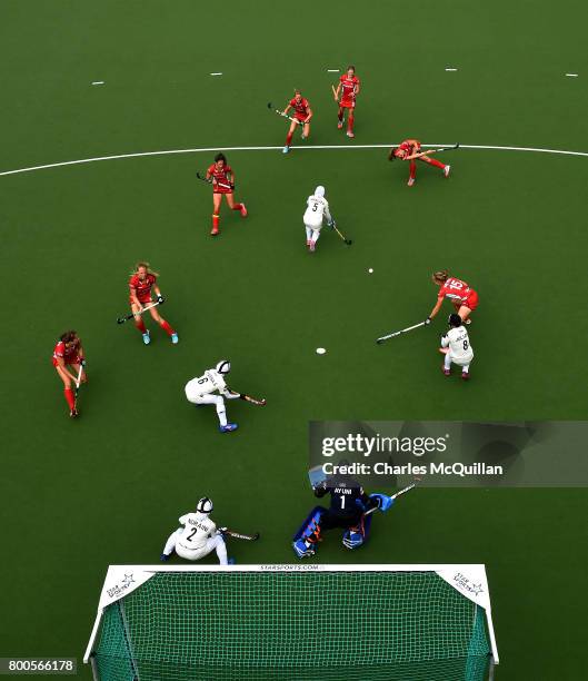 Malaysia defend a Belgium penalty corner during the FINTRO Women's Hockey World League Semi-Final Pool B game between Belgium and Malaysia on June...