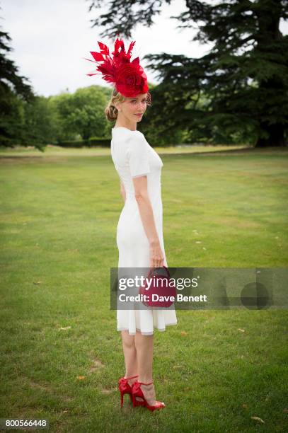 Tatiana Korsakova wearing a Dolce & Gabbana dress, Arturo Rios Hat, BUwood bag and Christian Louboutin shoes For Royal Ascot on June 24, 2017 in...