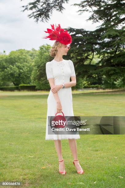 Tatiana Korsakova wearing a Dolce & Gabbana dress, Arturo Rios Hat, BUwood bag and Christian Louboutin shoes For Royal Ascot on June 24, 2017 in...
