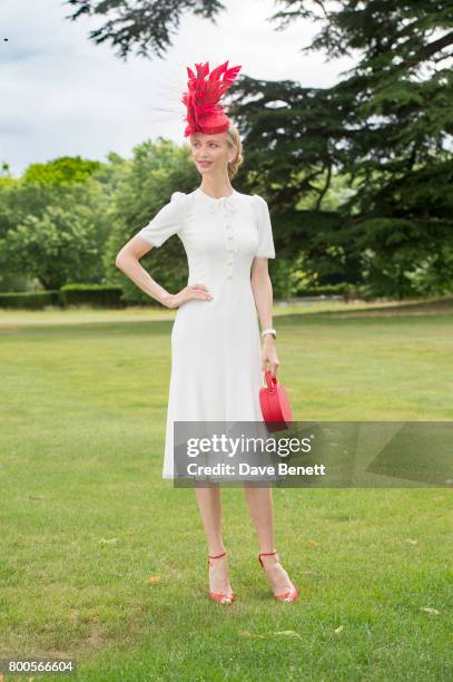 Tatiana Korsakova wearing a Dolce & Gabbana dress, Arturo Rios Hat, BUwood bag and Christian Louboutin shoes For Royal Ascot on June 24, 2017 in...