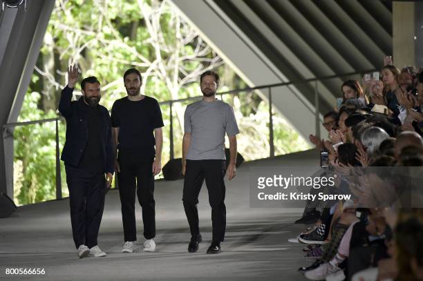 Designers Jose Lamali, Jeremie Egry and Aurelien Arbet acknowledge the audience during the Etudes Menswear Spring/Summer 2018 show as part of Paris...
