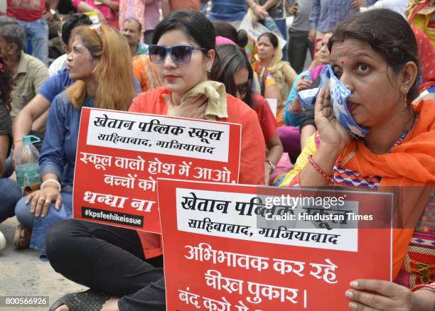 Parents and association members staged protest outside Khaitan Public School after the institution expelled 35 students for not depositing the...