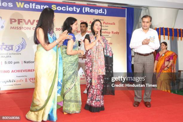 Amulya Patnaik, Delhi Police Commissioner, Suchana Patnaik, President, PFWS with Neelam Pratap Rudy during the launch of Neele Pankh, an initiative...