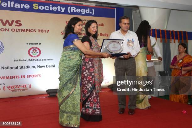 Amulya Patnaik, Delhi Police Commissioner, Suchana Patnaik, President, PFWS with Neelam Pratap Rudy during the launch of Neele Pankh, an initiative...