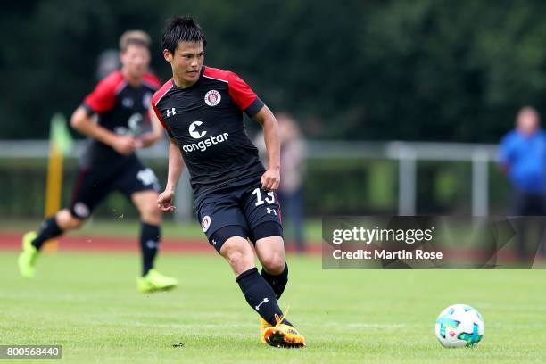 Ryo Miyaichi of St. Pauli runs with the ball during the preseason friendly match between Buxtehuder SV and FC St. Pauli at on June 24, 2017 in...