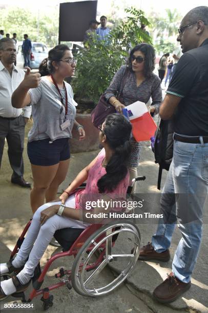 Physically challenged student and her parents being guided by volunteer during an admission process for the new Academic Year 2017-18, at Lady Shri...