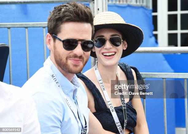 Tom Riley and Lizzy Caplan celebrate with Moet Ice Imperial in the Moet & Chandon Suite, whilst watching the action unfold on Centre Court, at the...
