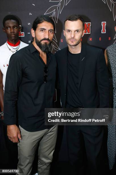 ACtor Numan Acar and Stylist Kris Van Assche pose Backstage after the Dior Homme Menswear Spring/Summer 2018 show as part of Paris Fashion Week on...