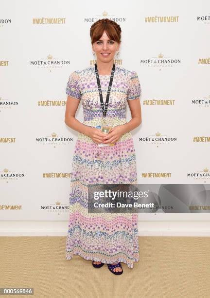 Ophelia Lovobond celebrates with Moet Ice Imperial in the Moet & Chandon Suite, whilst watching the action unfold on Centre Court, at the Aegon...