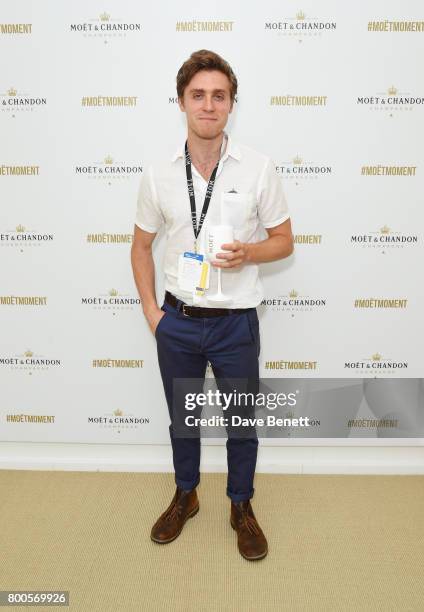 Jack Farthing celebrates with Moet Ice Imperial in the Moet & Chandon Suite, whilst watching the action unfold on Centre Court, at the Aegon...