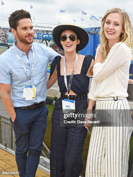 Tom Riley, Lizzy Caplan and Portia Freeman celebrate with Moet Ice Imperial in the Moet & Chandon Suite, whilst watching the action unfold on Centre...