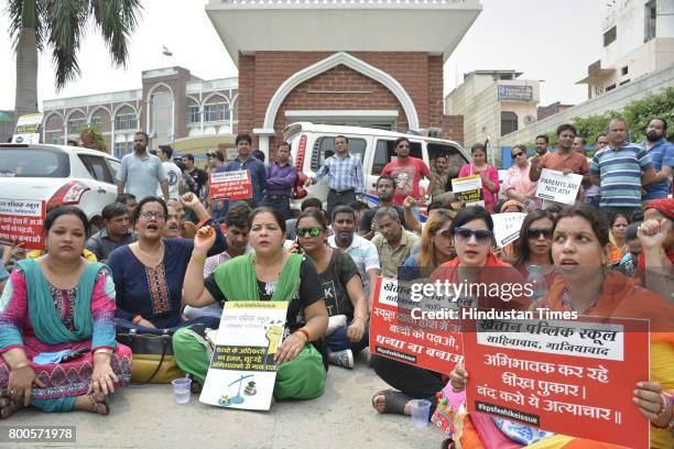 Parents and association members staged protest outside Khaitan Public School after the institution expelled 35 students for not depositing the...