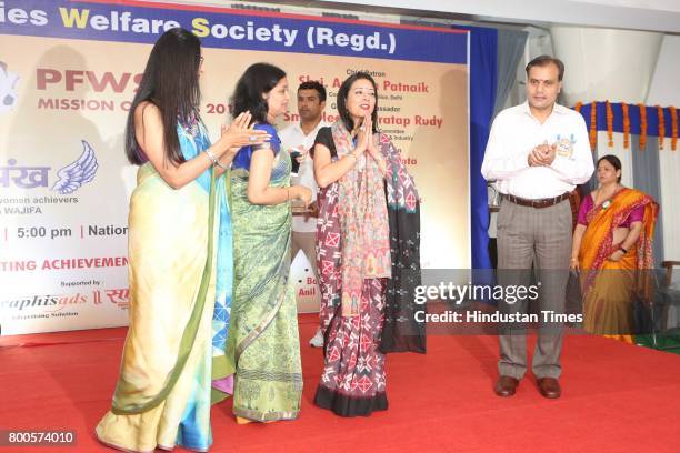 Amulya Patnaik, Delhi Police Commissioner, Suchana Patnaik, President, PFWS with Neelam Pratap Rudy during the launch of Neele Pankh, an initiative...