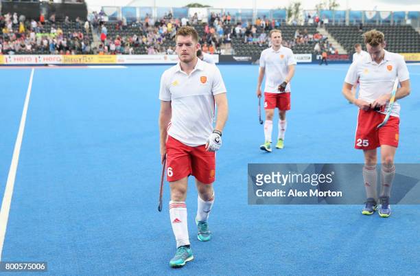 Henry Weir of England and teammates look dejected after the semi-final match between England and the Netherlands on day eight of the Hero Hockey...