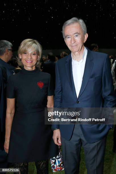 Owner of LVMH Luxury Group Bernard Arnault and his wife Helene Mercier-Arnault attend the Dior Homme Menswear Spring/Summer 2018 show as part of...