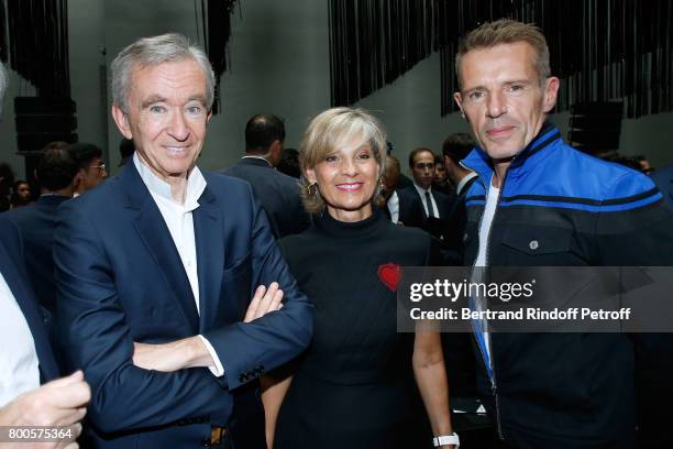 Owner of LVMH Luxury Group Bernard Arnault, his wife Helene Mercier-Arnault and actor Lambert Wilson attend the Dior Homme Menswear Spring/Summer...