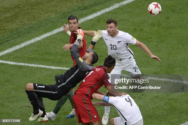 Portugal's defender Pepe, Portugal's goalkeeper Rui Patricio and Portugal's defender Bruno Alves vie with New Zealand's defender Tommy Smith and New...