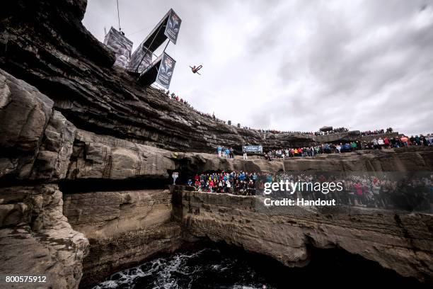 In this handout image provided by Red Bull, Jonathan Paredes of Mexico dives from the 27.5 metre platform at the Serpent`s Lair during the first stop...